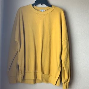 Charlotte Rues mustard yellow sweatshirt
